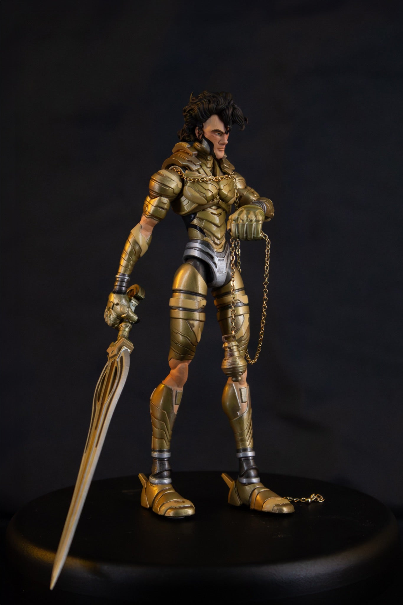 Mikha'el 7" action figure — three-quarter side view, sword and chain
