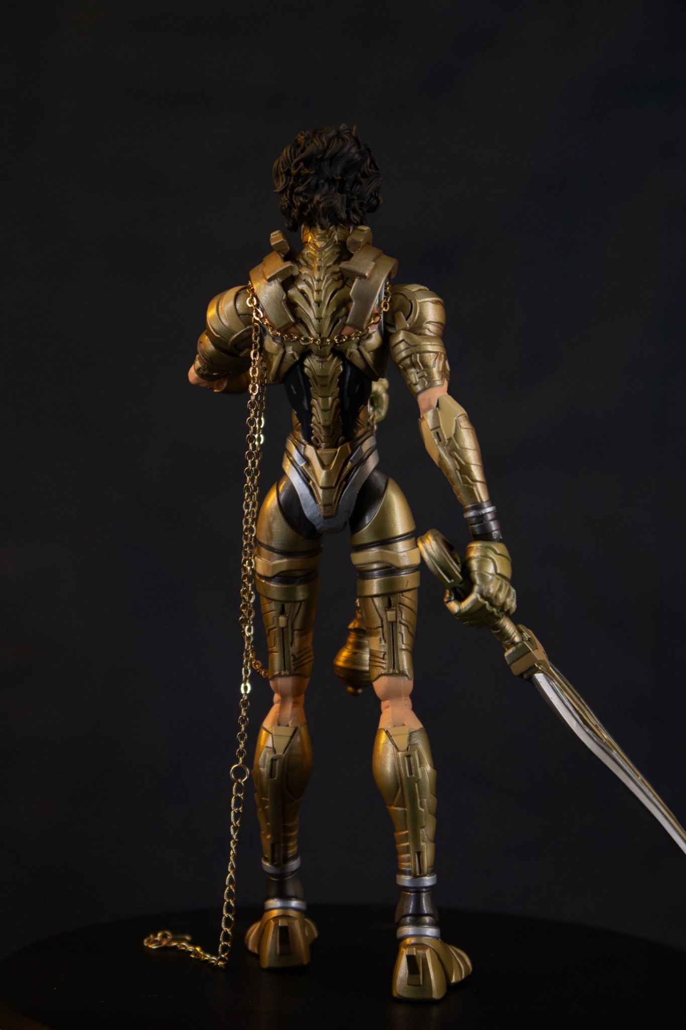 Mikha'el 7" action figure — back view, chains and sword
