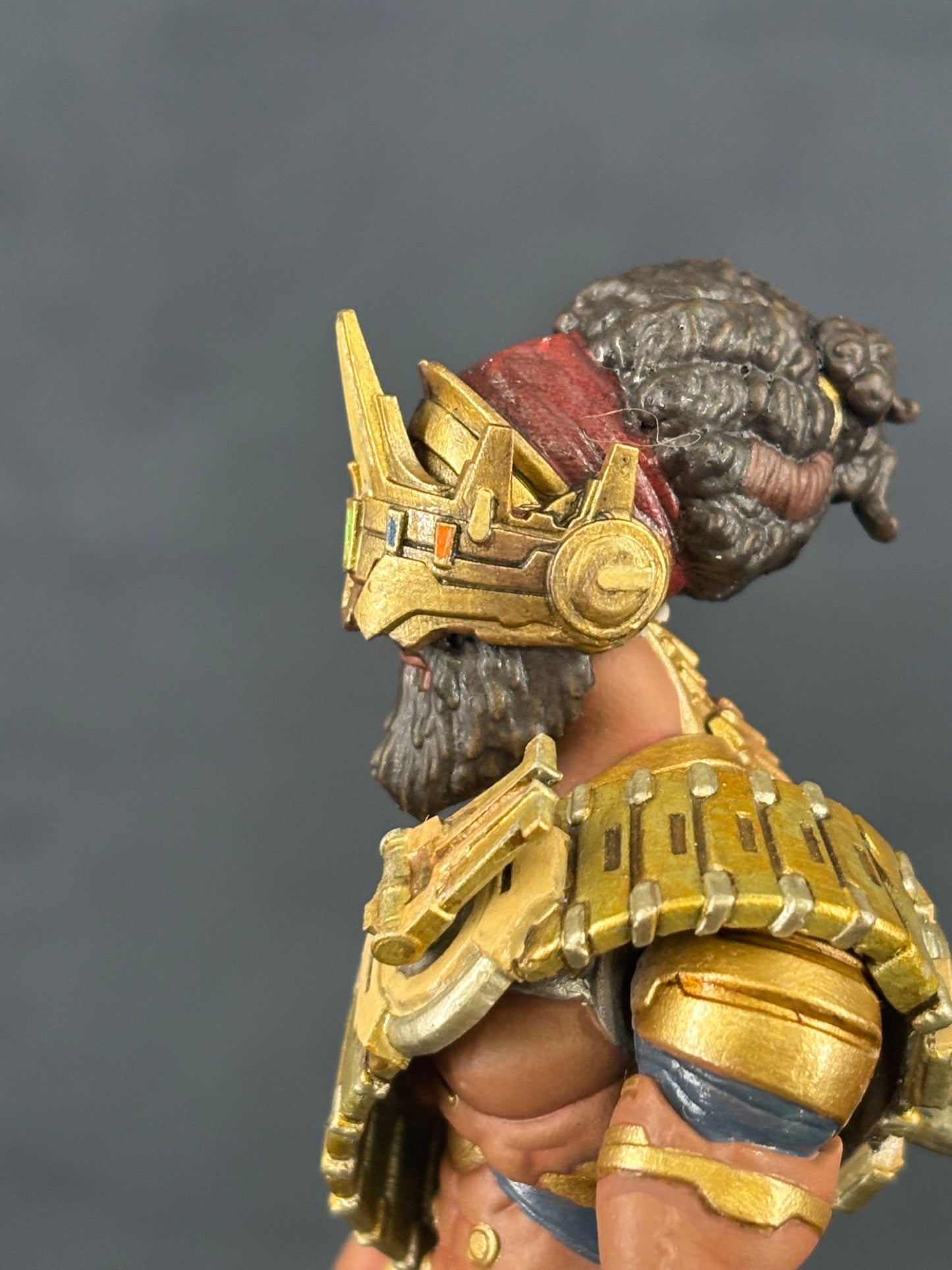 Yeshua 7" action figure — in-hand close-up: gauntlet and armor pieces